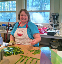 glassworks Kathy Oda working on glass